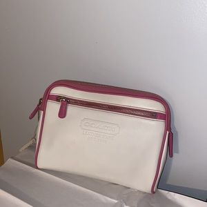 Pink and white Coach clutch.